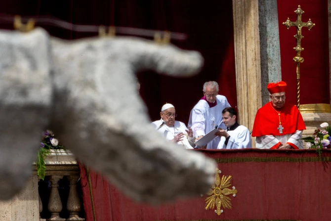 Pope Francis wishes the crowd a “Happy Easter” from the central loggia of St. Peter's Basilica on Easter Sunday, April 20, 2025
