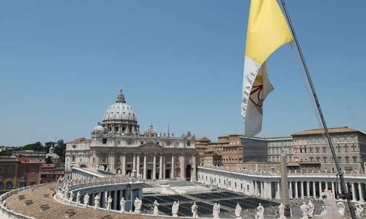 a view of st peters basilica 2 and vatican city flag from the roof of a nearby building on june 5 2015 credit bohumil petrik cna 6 5 15 1525469732