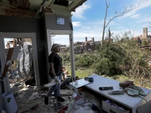 “I have never seen anything like this,” said Jerikah McCloud, 23, who looks out the destroyed second floor of her family home in the Academy neighborhood of St. Louis on Saturday, May 17, 2025, after the National Weather Service confirmed a tornado struck the city the day before.