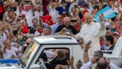 Pope Leo XIV greets the faithful at a Pentecost prayer vigil in St. Peter's Square, Saturday, June 7, 2025